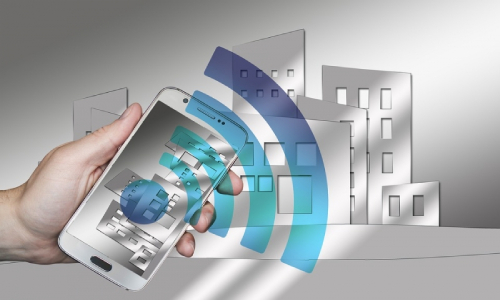 Person Holding Phone on Hand Sending Wifi Signals