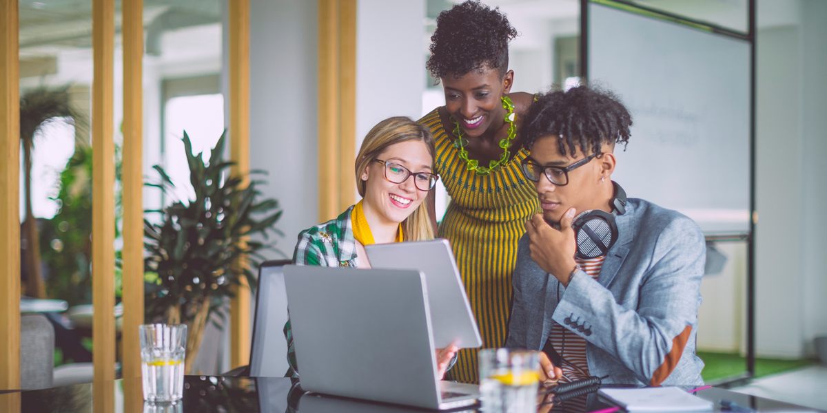 internship Group of people looking at a computer