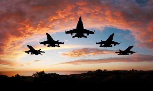 Five Fighter Jets Flying in Formation