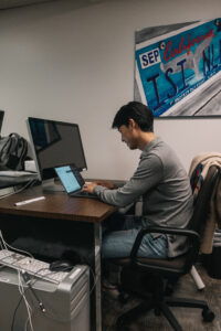 Researcher working on computer