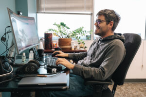 Researcher working on computer