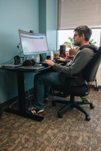 Researcher working on computer
