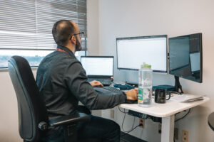 Researcher working on computer