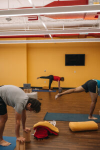 Yoga room with people practicing yoga
