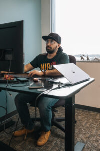 Researcher working on computer